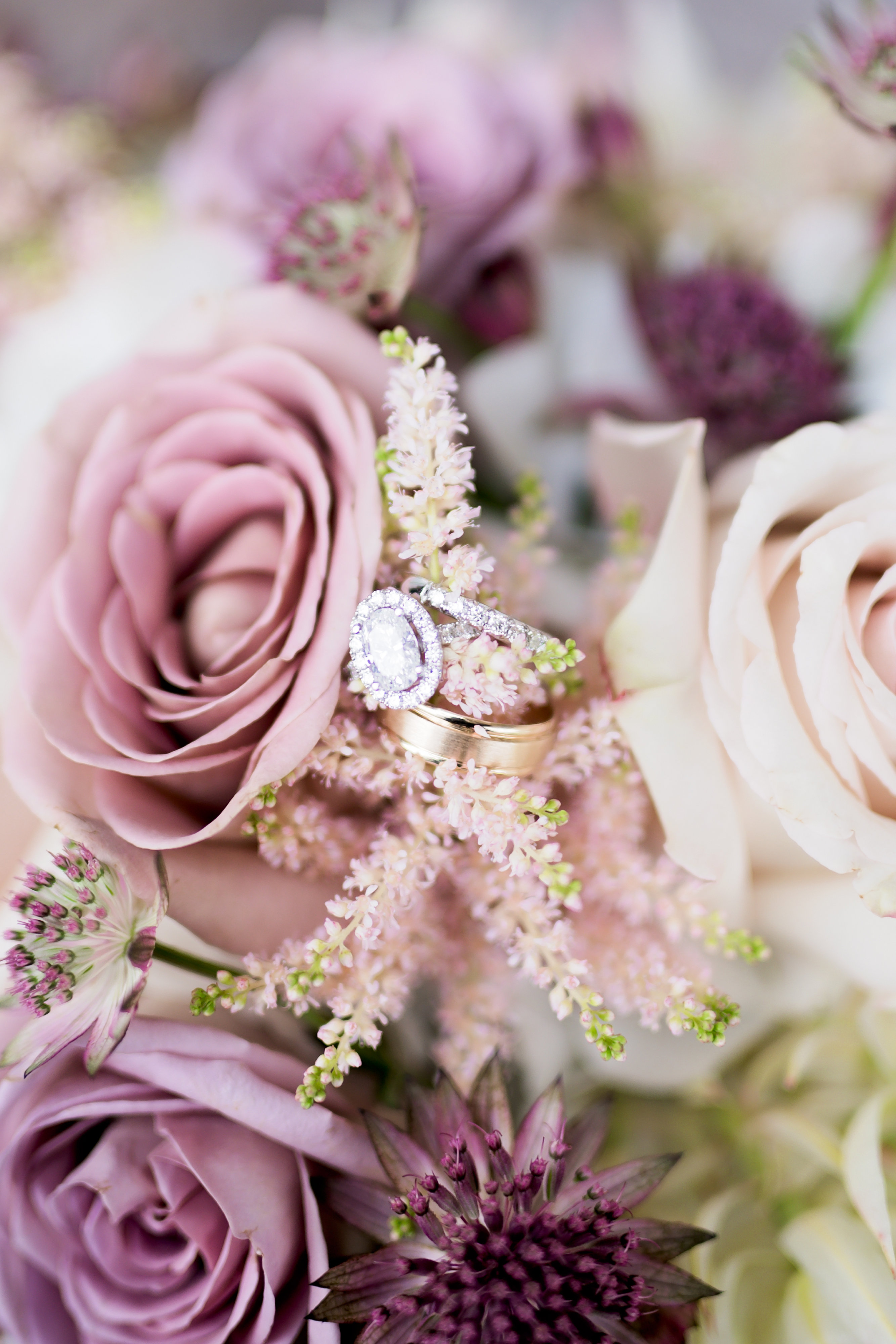 wedding rings, purple bouquet, event planner
