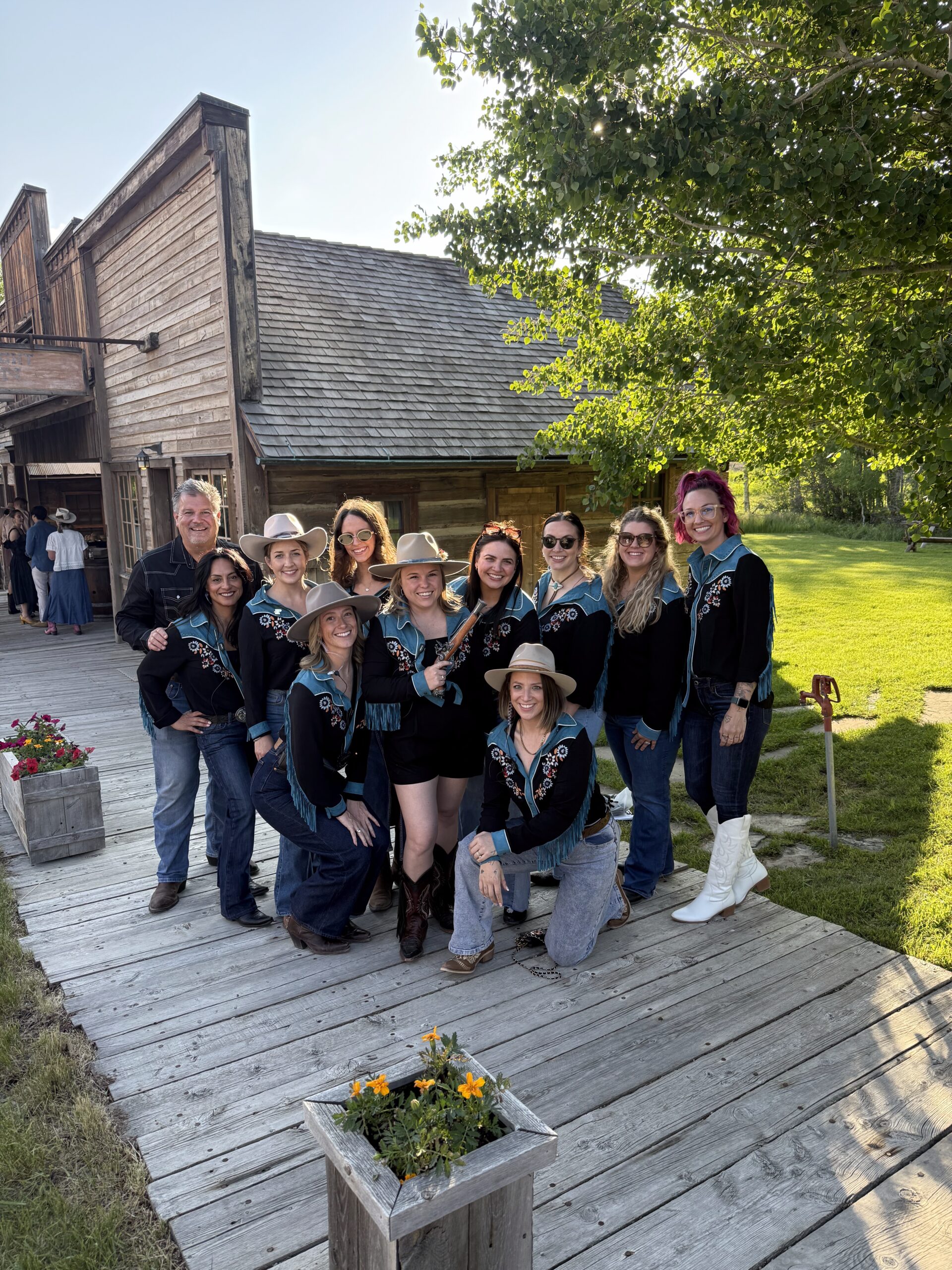 The planning team at Pop Parties traveling for a ranch wedding, dressed in matching Western shirts.