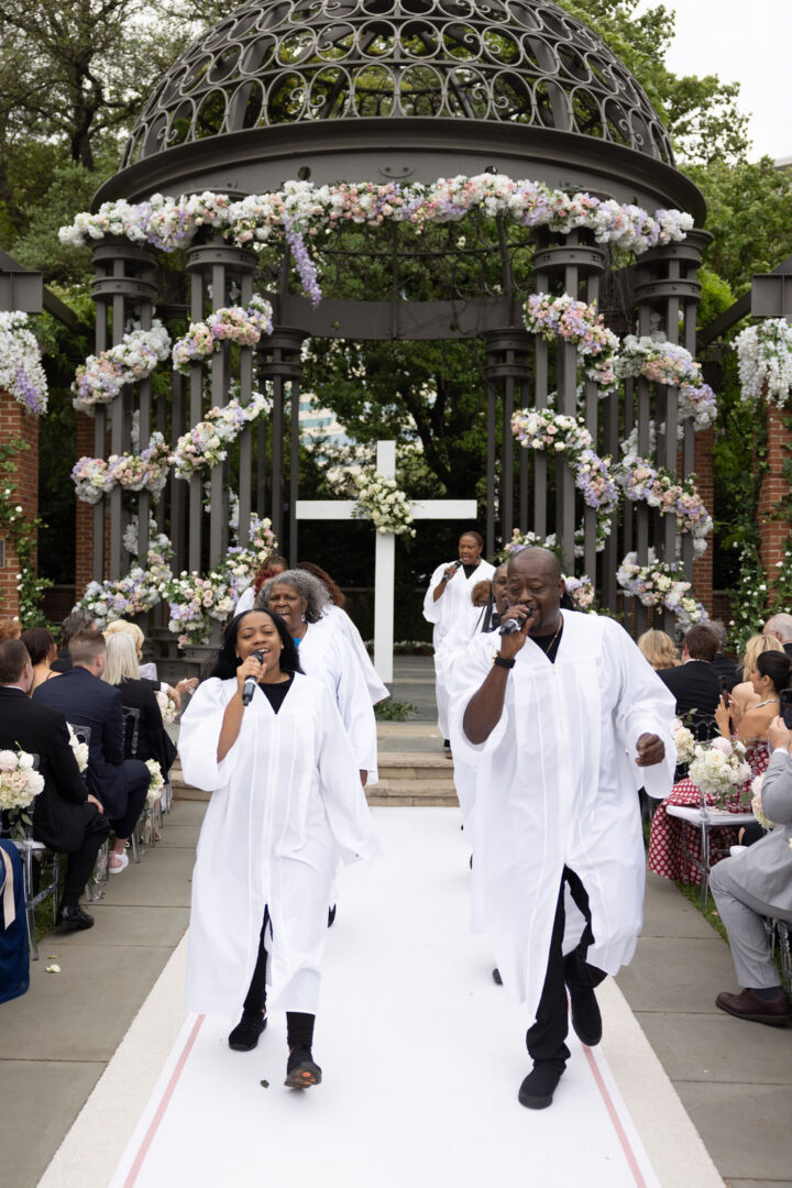 A Gospel choir provides recessional entertainment at a wedding reception.
