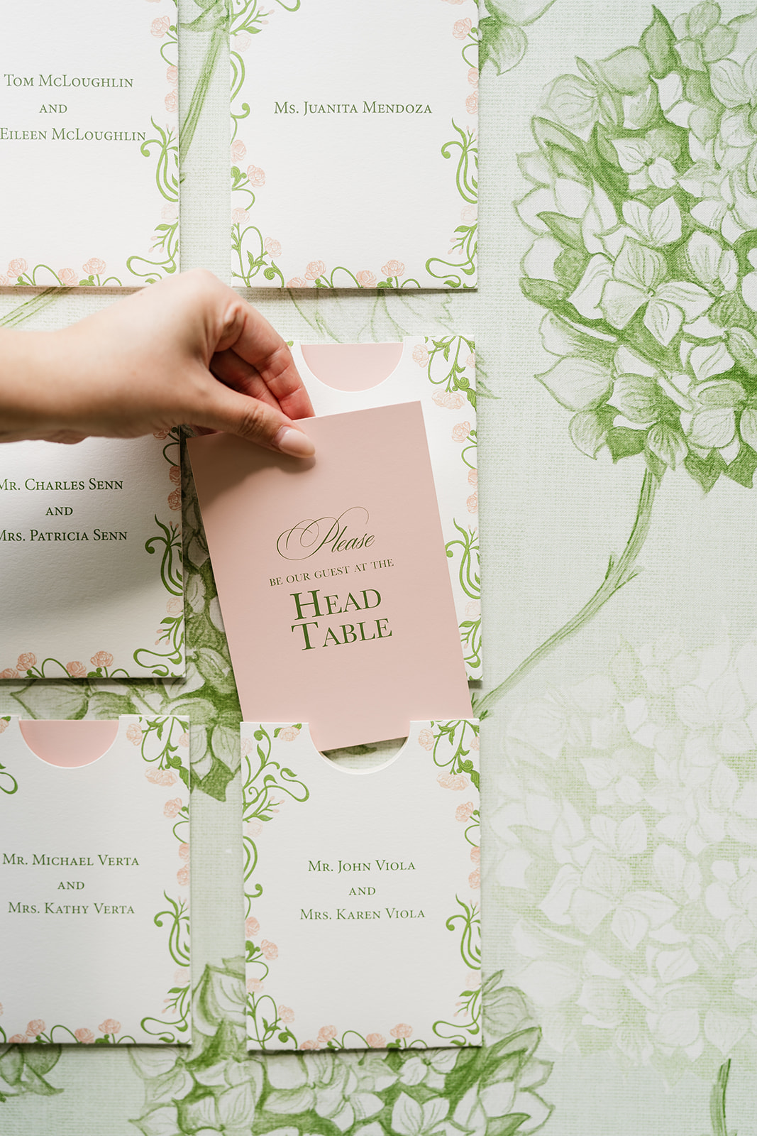 A close-up of a custom escort card wall for a wedding, showcasing proper etiquette.