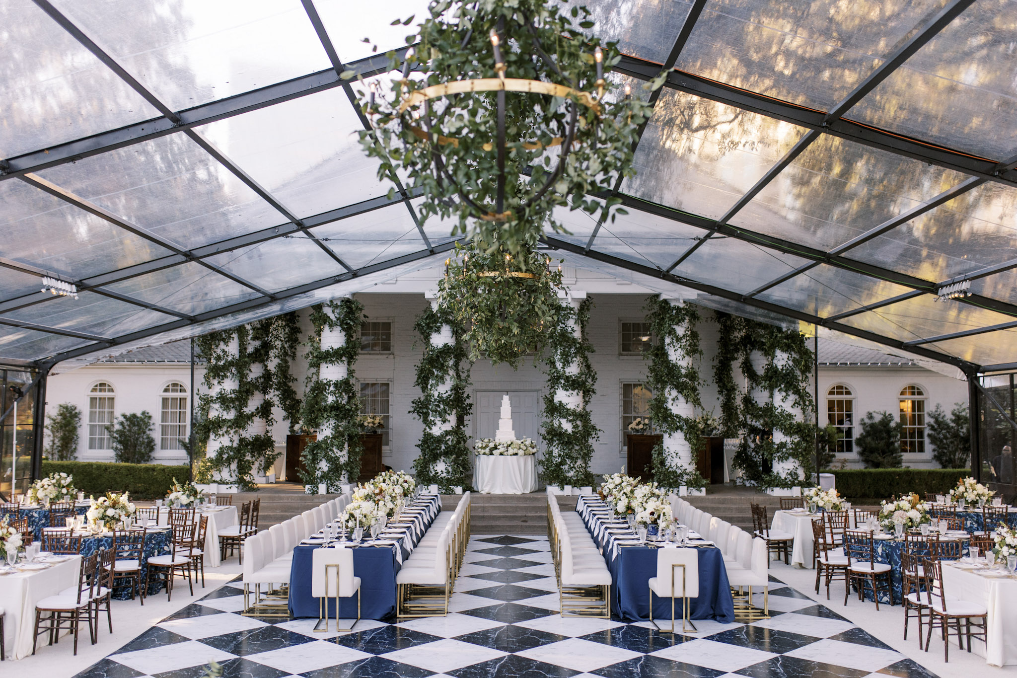 Deep blues and greens with neutral accents highlight a polo club-inspired wedding reception held in a historic Dallas mansion.